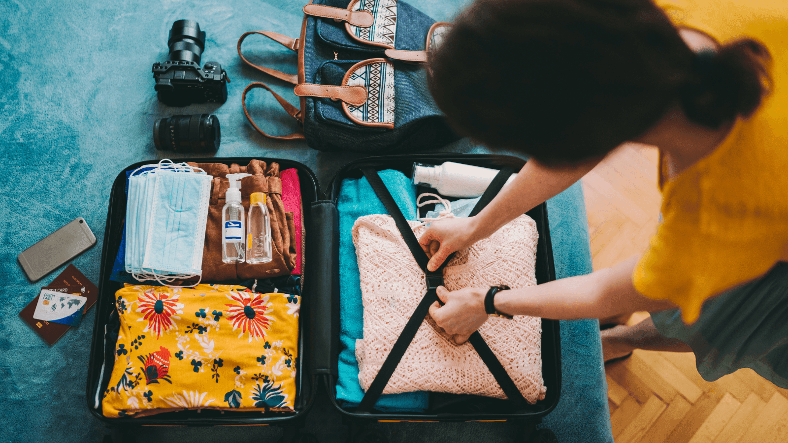 Women packing a travel suitcase
