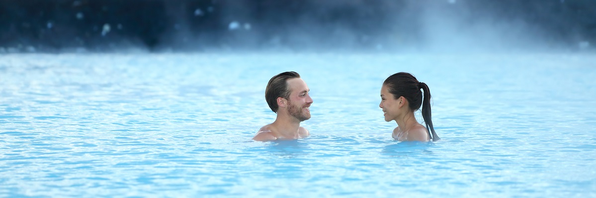 Couple enjoying a hot spring in Iceland