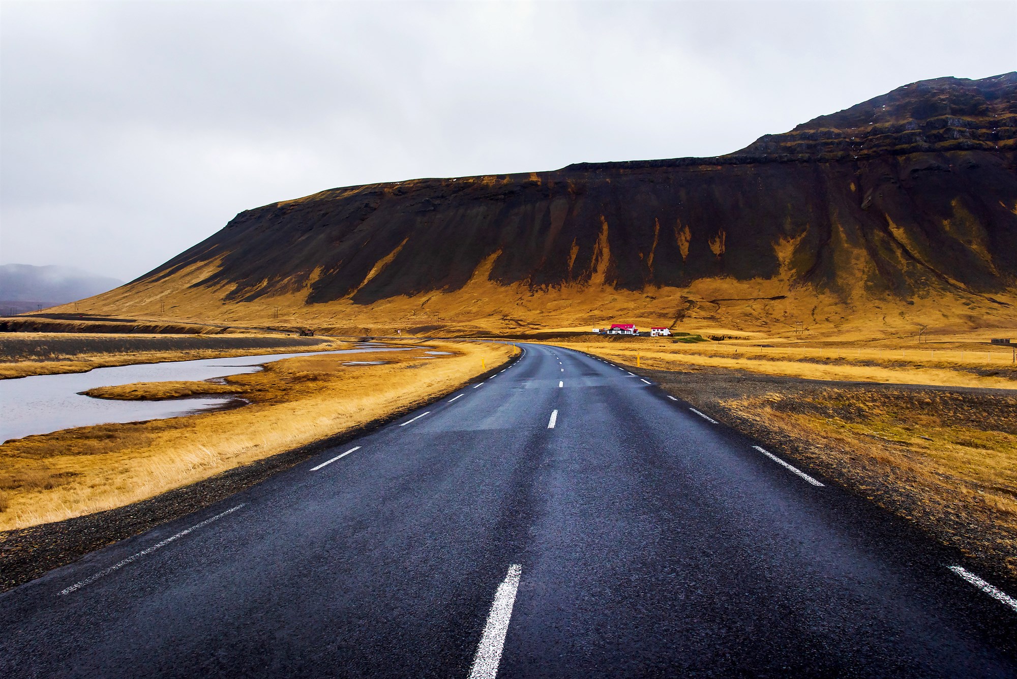 Open road on Snaefellsnes peninsula in Iceland with mountains