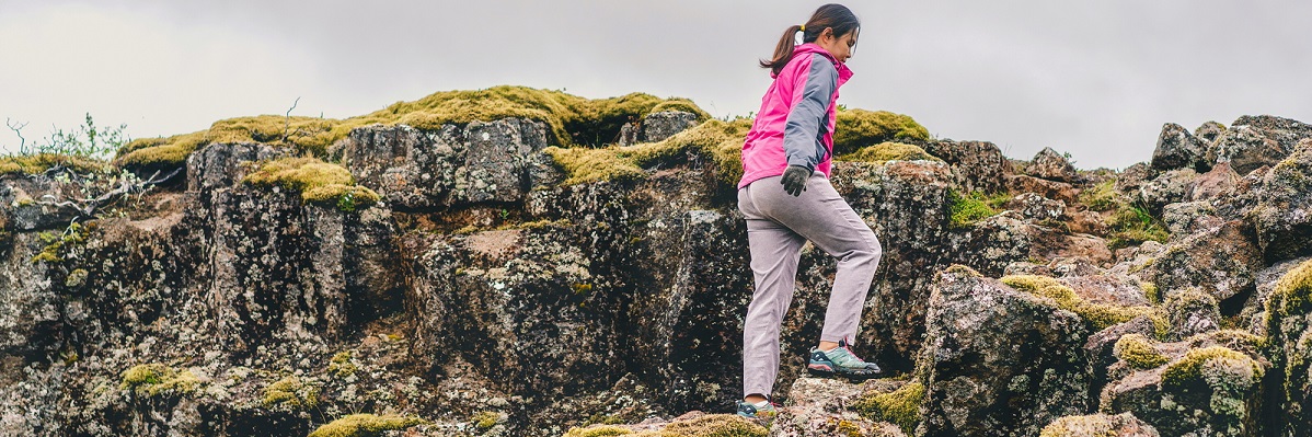 Woman hiking in Iceland in pink jacket