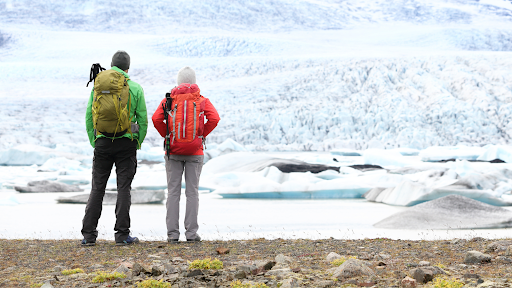 Couple admiring the glaciers in Iceland