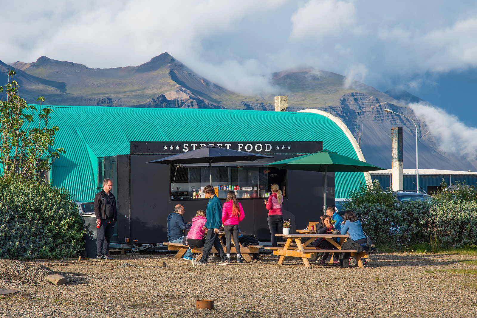 Tourists at a street food wagon in Iceland.