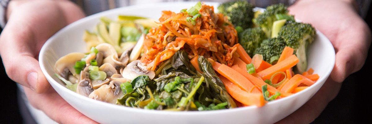 Healthy vegan food in white bowl