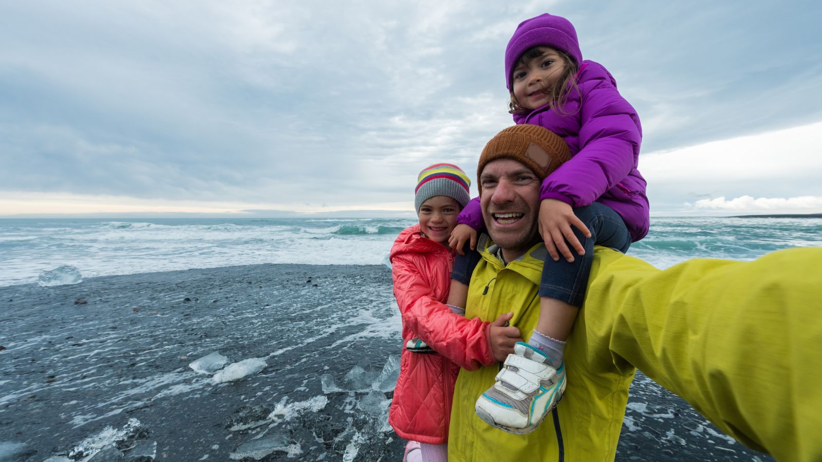 A Father with his 2 children on an Icelandic beach