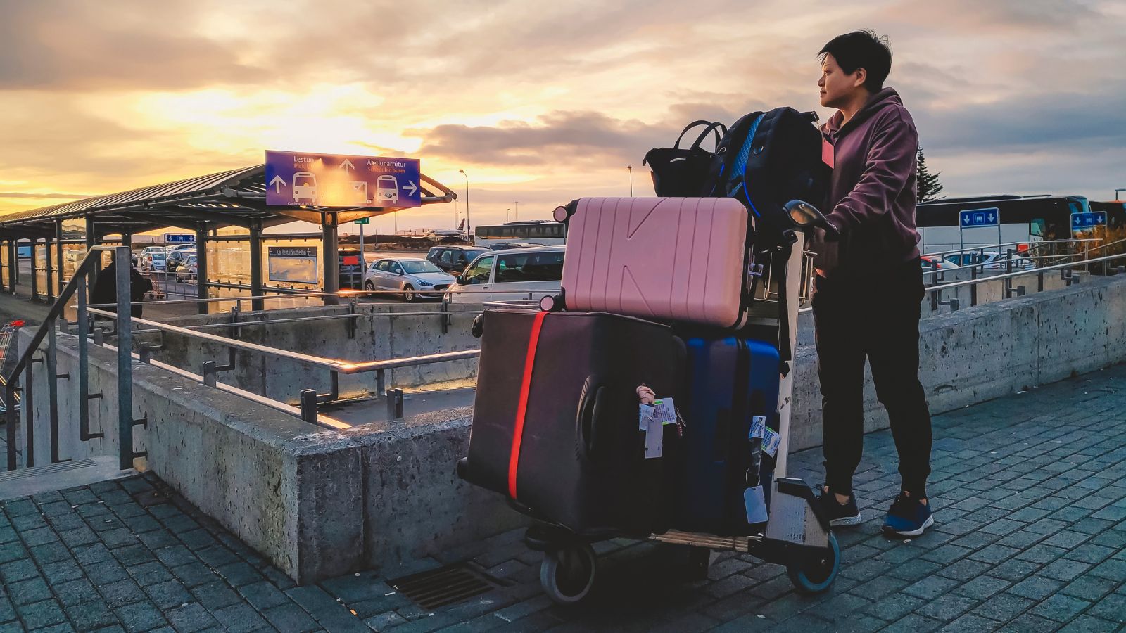 Tourist with suitcases at Keflavík Airport.