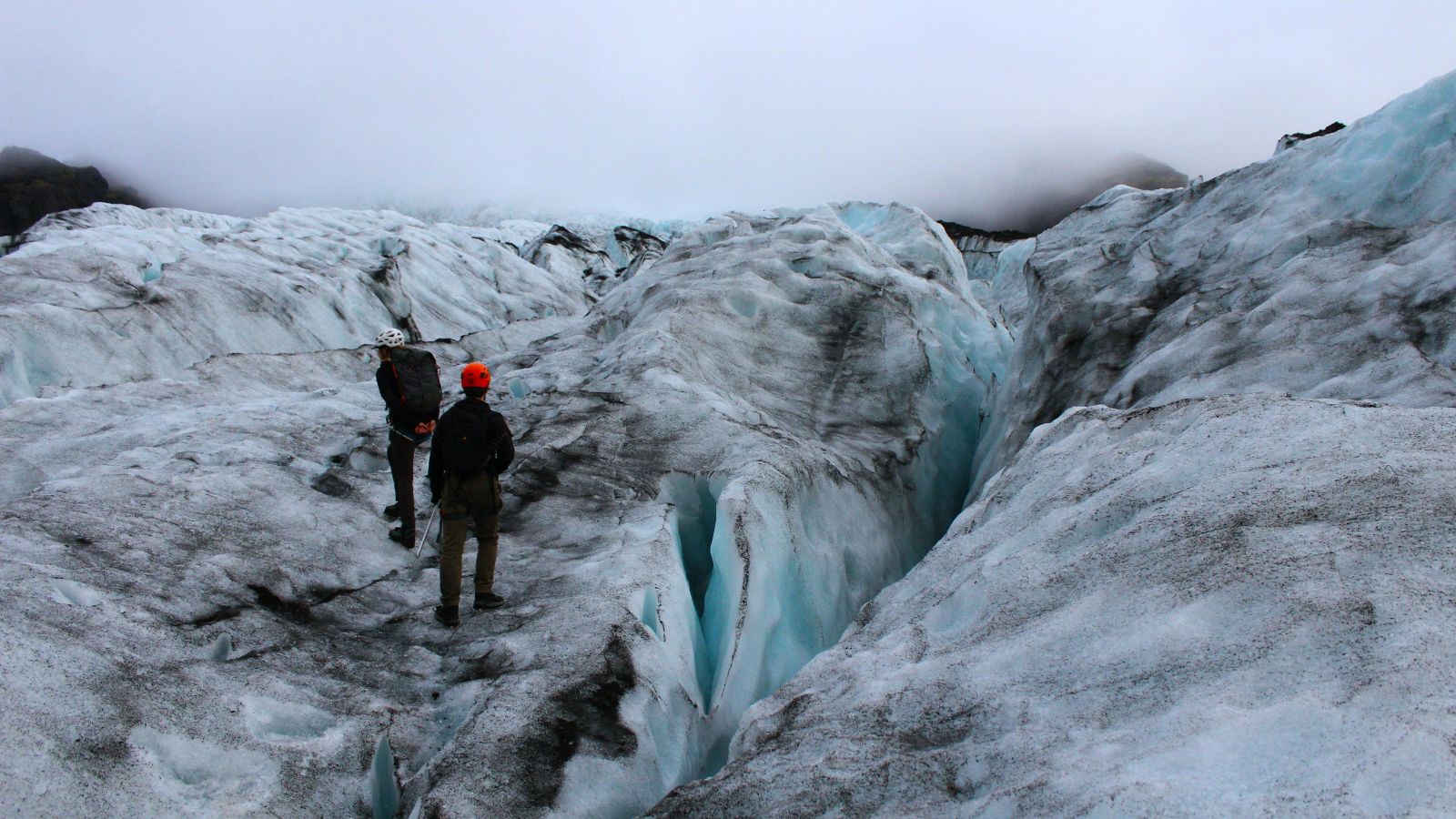 People hiking on a glacier in Iceland.
