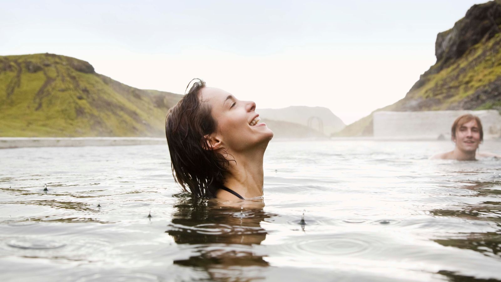 People relaxing in a hot spring in Iceland