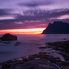 Midnight sun over coastline in Iceland