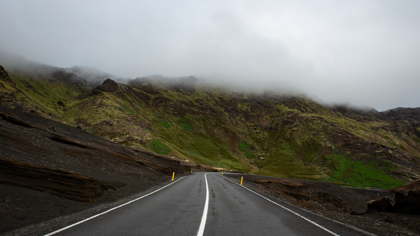 Road winding through a mountainous area of Iceland.
